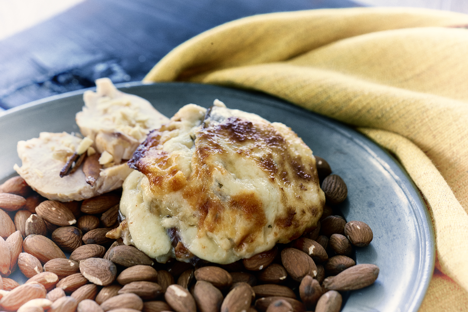 Chicken breast fillet in almond sauce with eggplant and manchego tapas